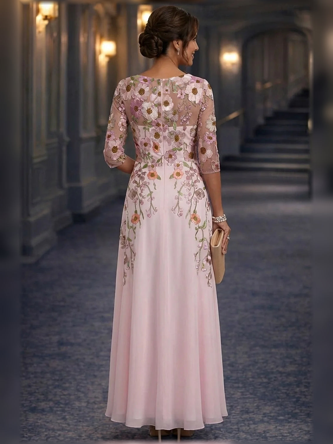 Back view of blush pink floral embroidered A-line maxi chiffon dress with 3/4 sleeves