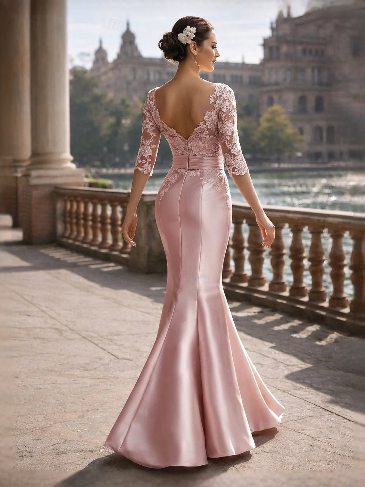 Pink satin mermaid gown with lace bodice, V-back detail, and front slit