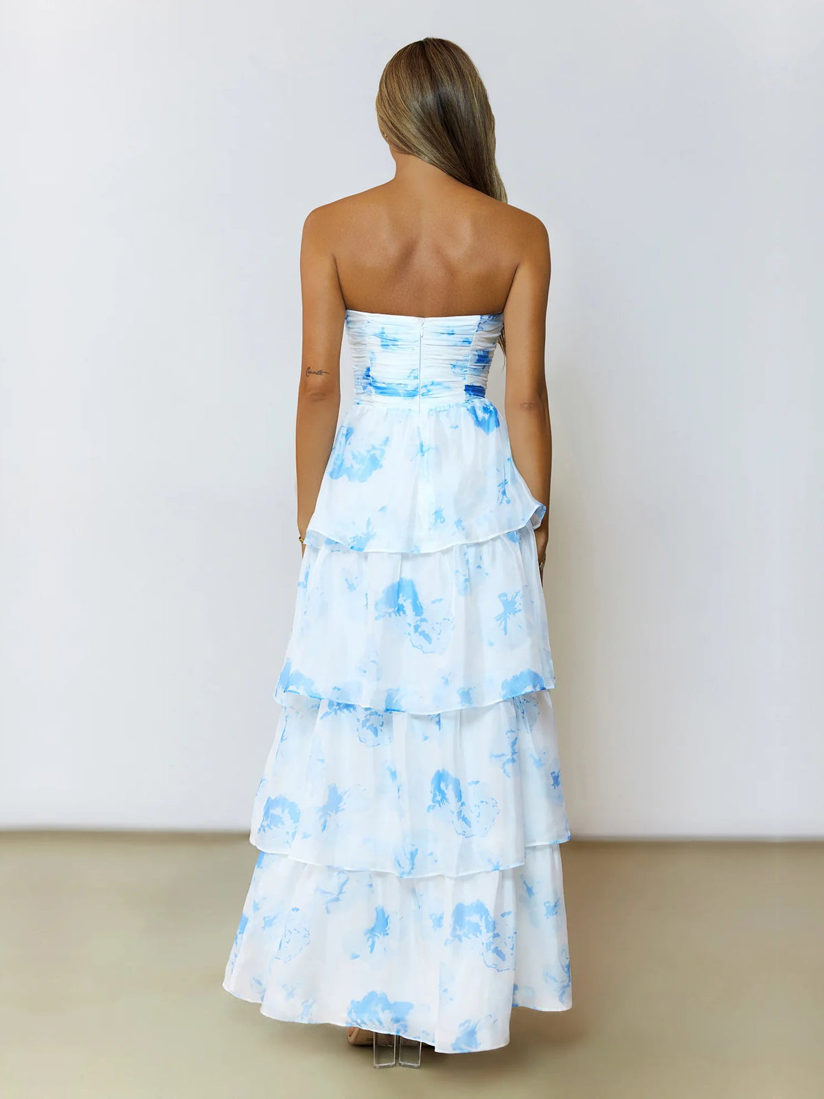 Blue a-line maxi formal dress with printed pattern, full-length back view