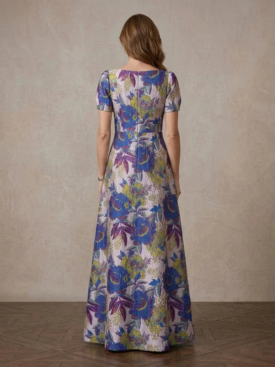 Back view: floral boat-neck A-line maxi dress, cobalt blue with multicolor blooms