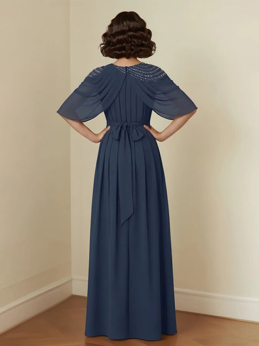 Dark navy pleated A-line dress with beaded back yoke and draped shoulder sleeves