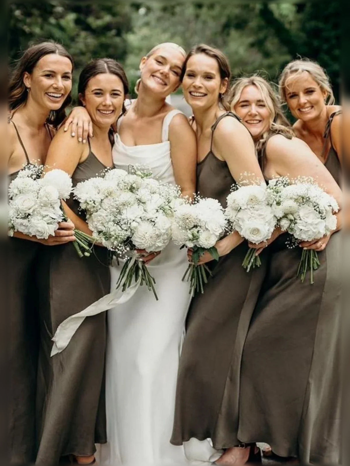 Olive satin cowl-neck A-line tea-length dress on bridesmaid, side view.