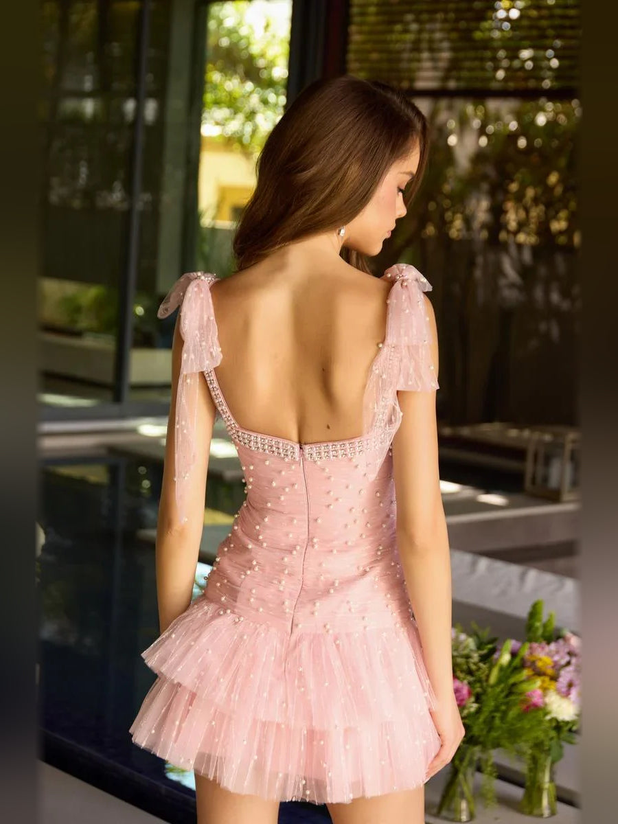 Blush pink mini tulle dress with straight neckline, embellished bodice, open-back view