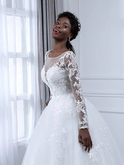 Ivory A-line tulle wedding dress with floral lace sleeves and round neckline, front three-quarter view