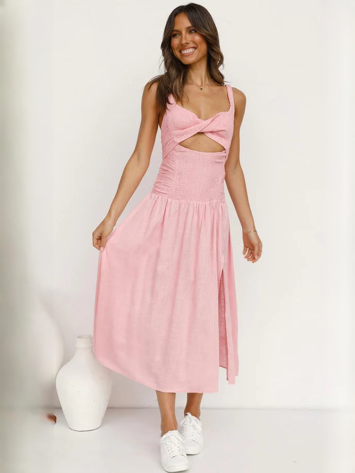 Blush pink midi formal dress with crisscross cutout bodice and tiered, flowy skirt