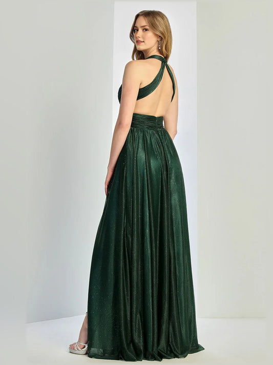 Dark green halter neck formal dress with open back and long flowing skirt