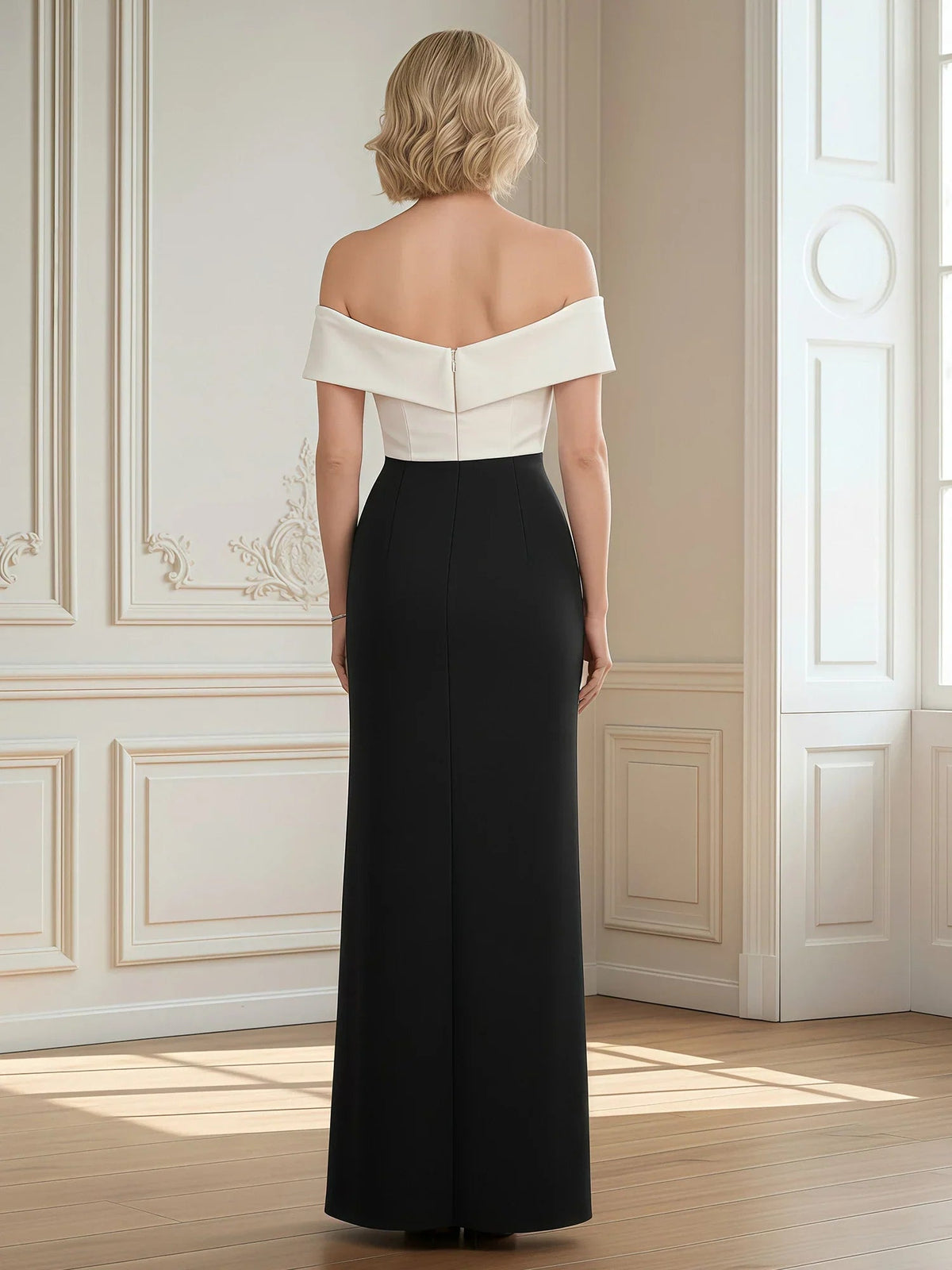 Back view of black floor-length off-shoulder sheath with cream off-shoulder strap detail