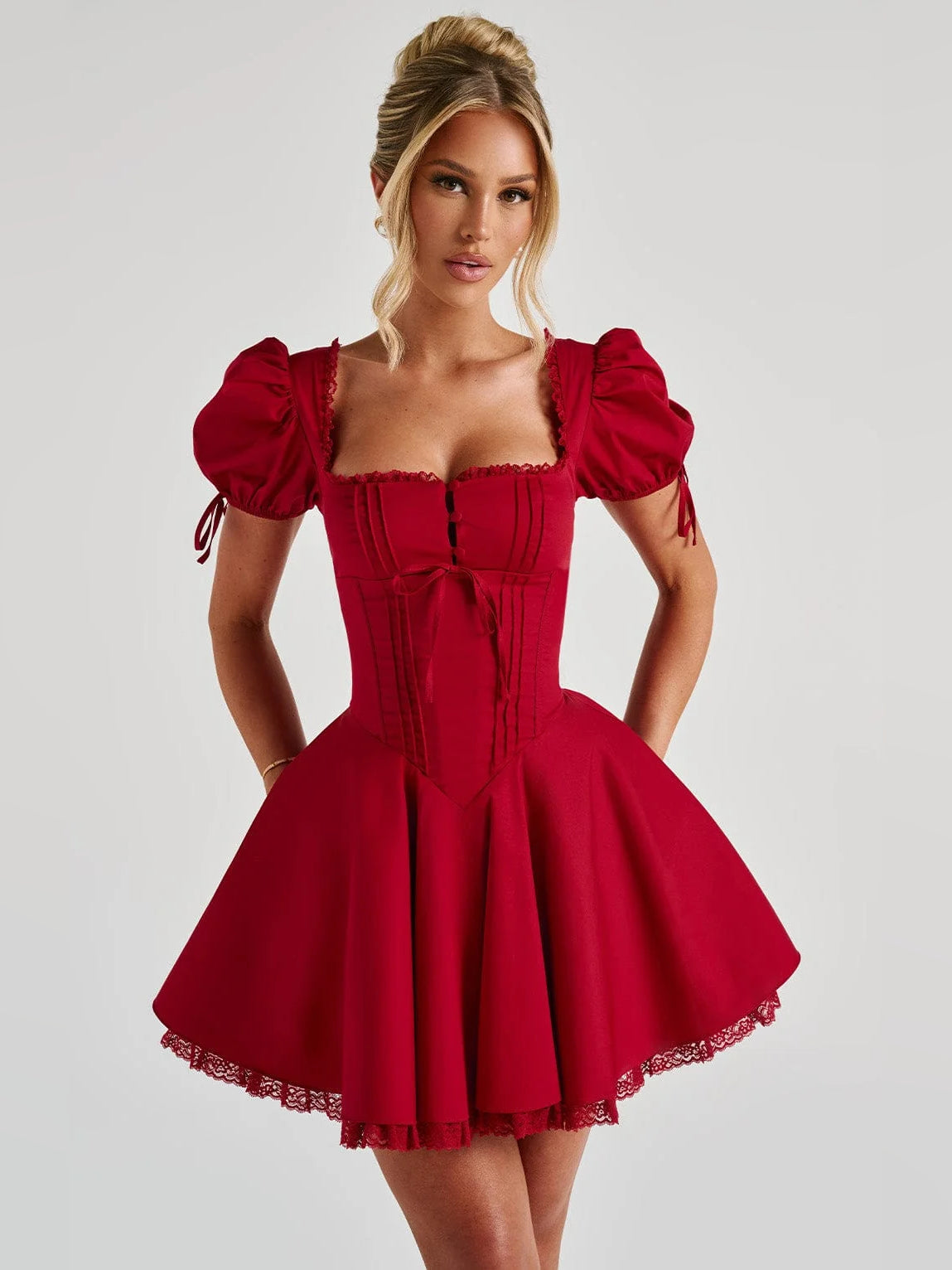 Red mini homecoming dress with square neckline, puff sleeves, corset bodice, flared skirt