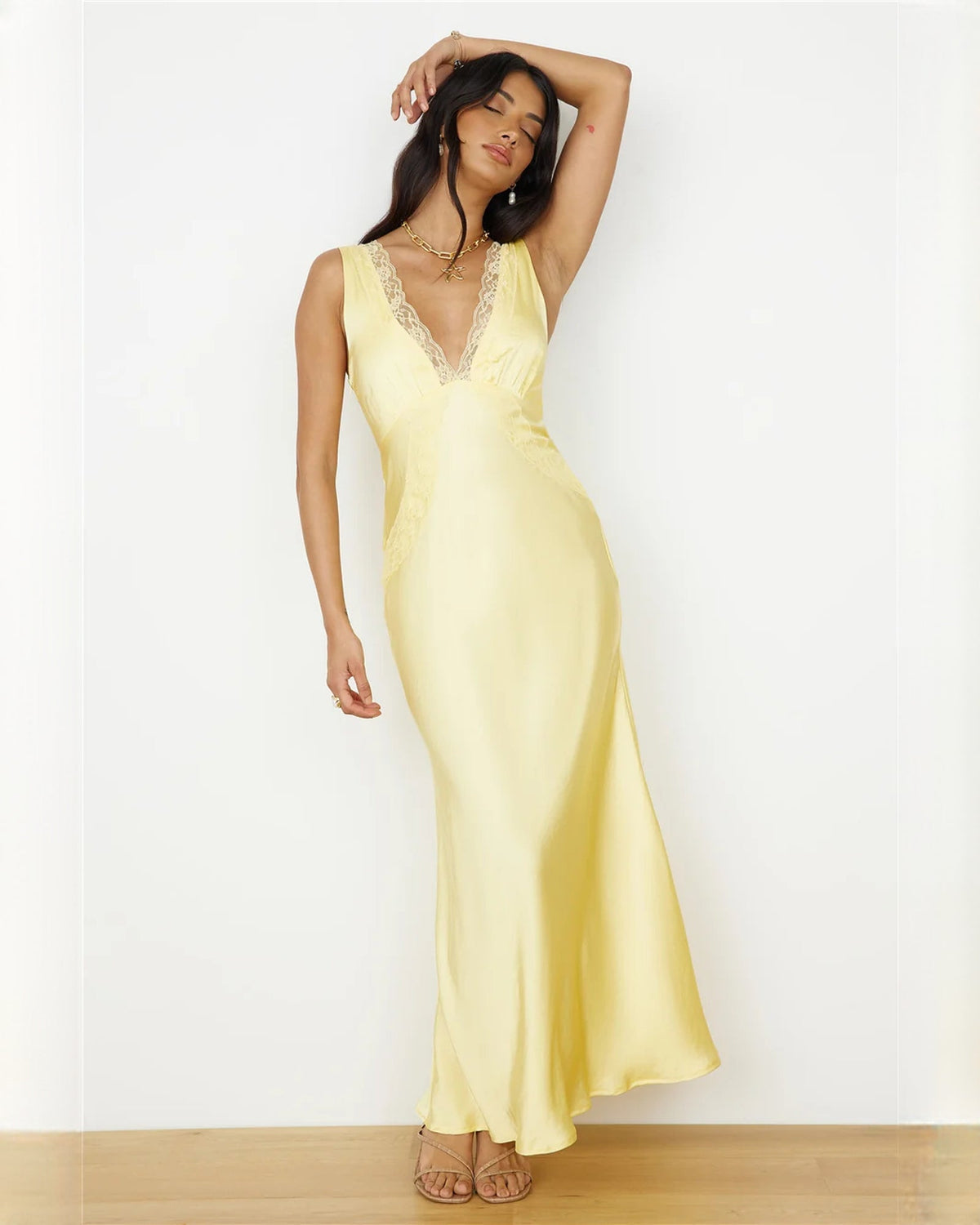 Light yellow satin A-line maxi bridesmaid dress with lace V-neck and sleeveless fit