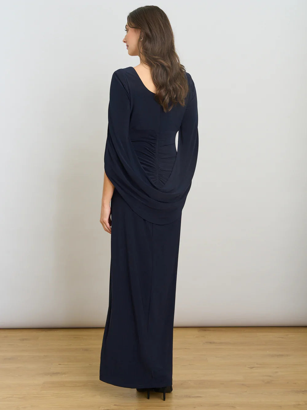 Dark navy ruched draped sheath maxi dress shown from back with long sleeves