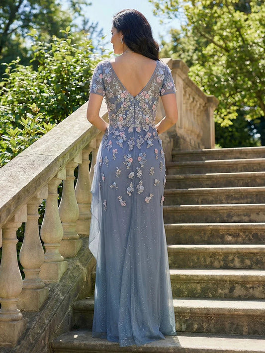 Steel blue chiffon mermaid dress viewed from the back with V-back and floral appliques