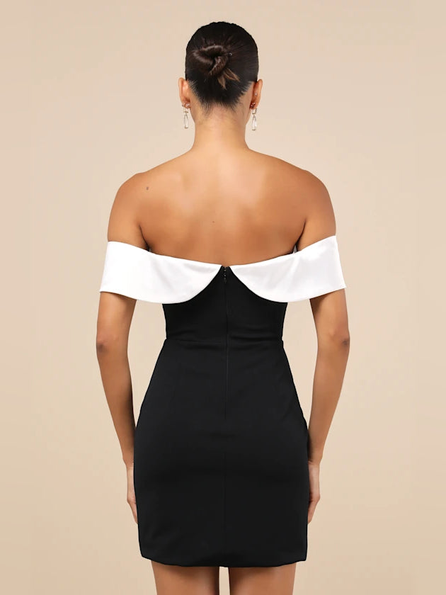 Black off-shoulder mini dress with white straps and open back