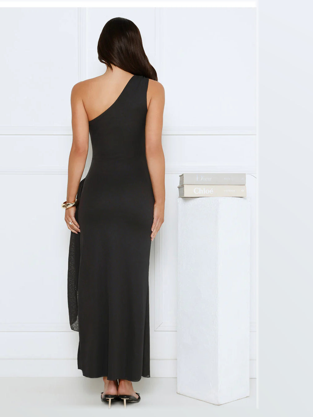 Black maxi formal dress, back full-length view showing the bodice