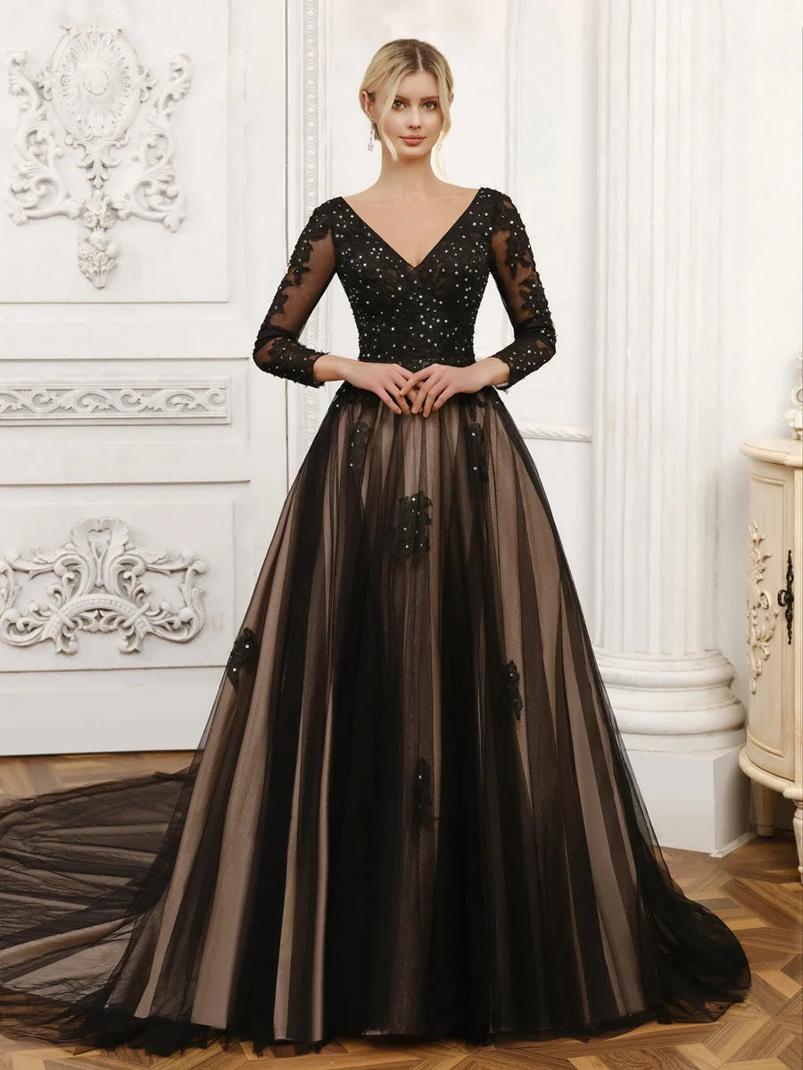 Black V-neck A-line tulle wedding dress with corset bodice, long sleeves, and sparkly appliques