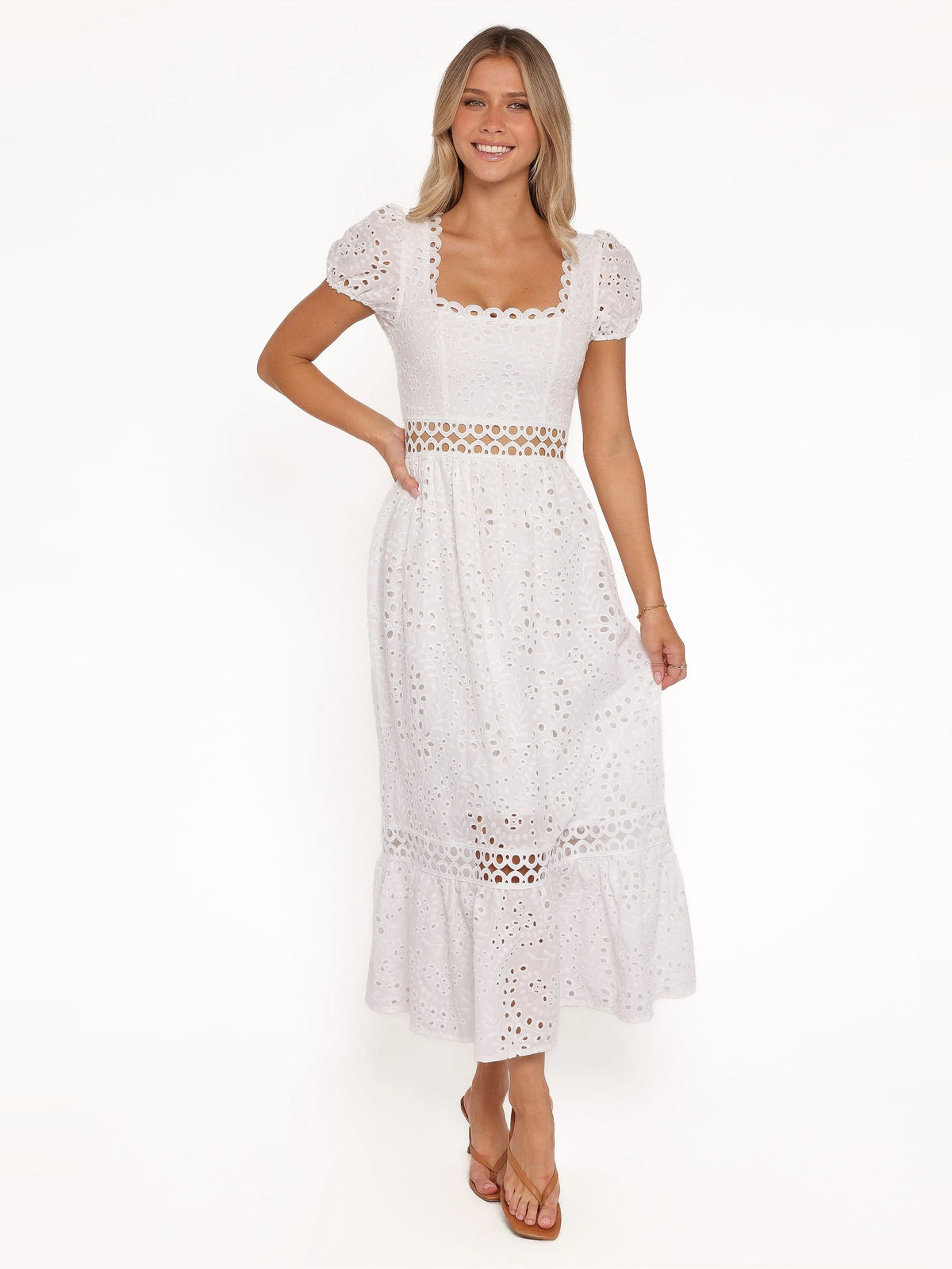 White midi formal dress with square lace neckline, eyelet texture, and tiered hem