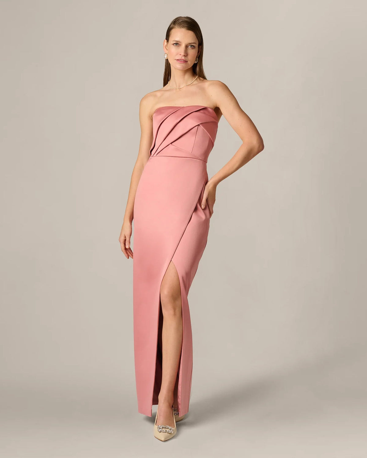 Rose strapless maxi dress with pleated bodice, side view, and front slit