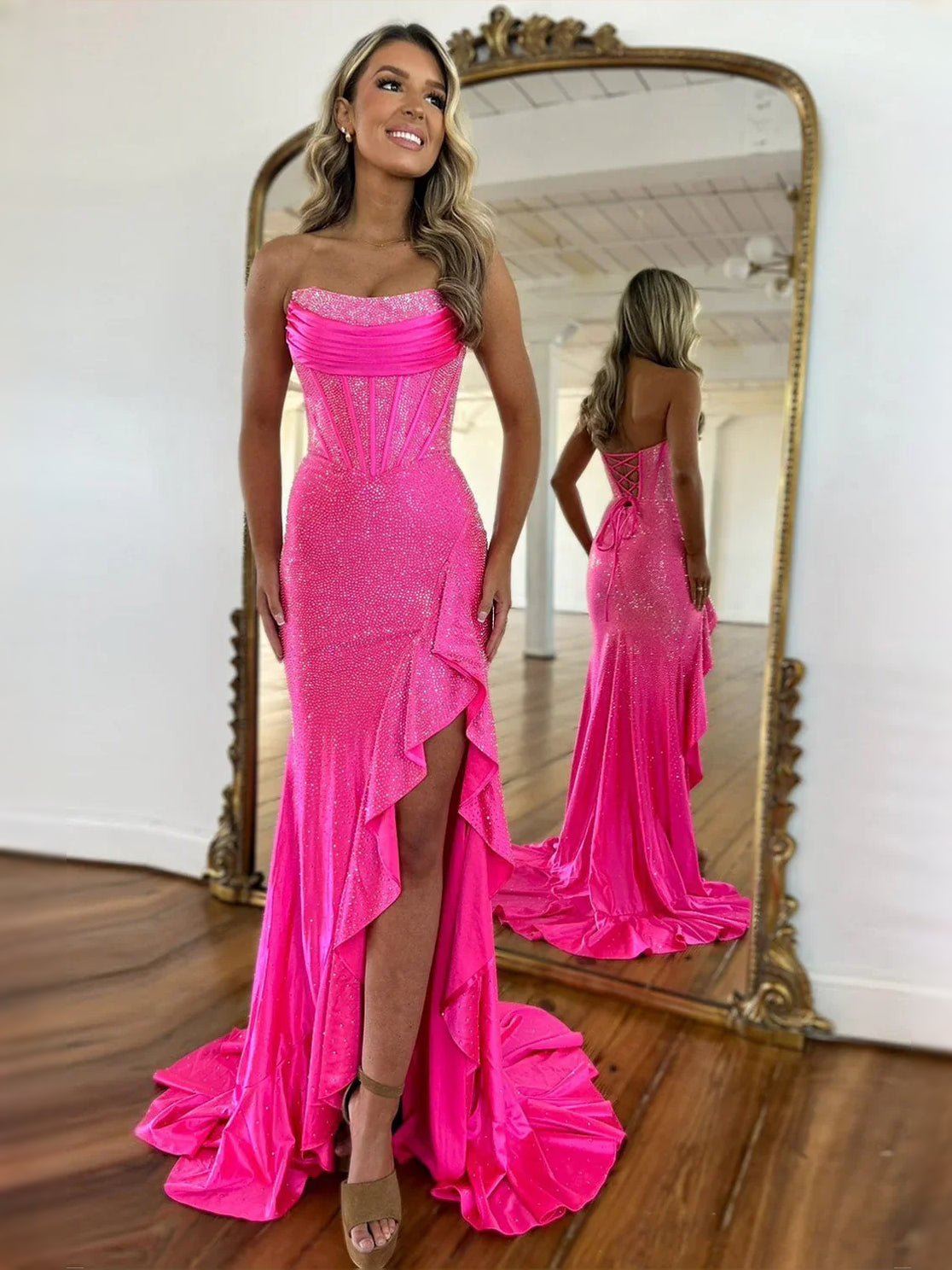 Hot pink corset sweetheart maxi prom dress with draped bodice and ruffled thigh slit