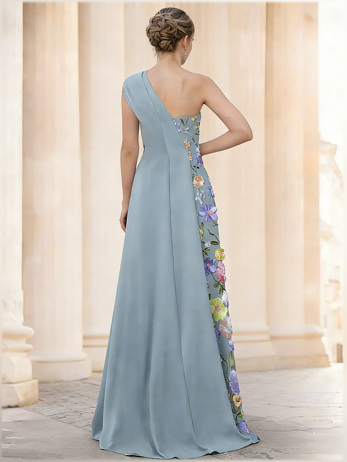 Dusty blue one-shoulder formal dress with floral embroidered side panel, open back, floor-length