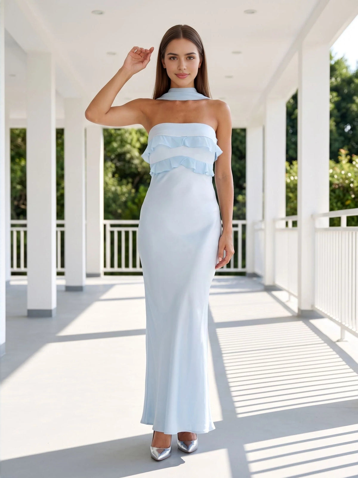 Sky blue strapless satin mermaid gown with tiered ruffle overlay at the bust