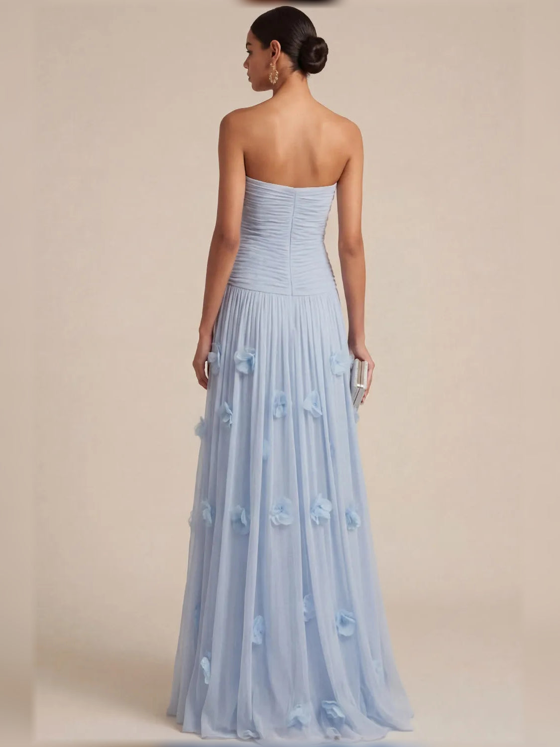 Light blue strapless formal dress, back view with ruched waist and floral appliques