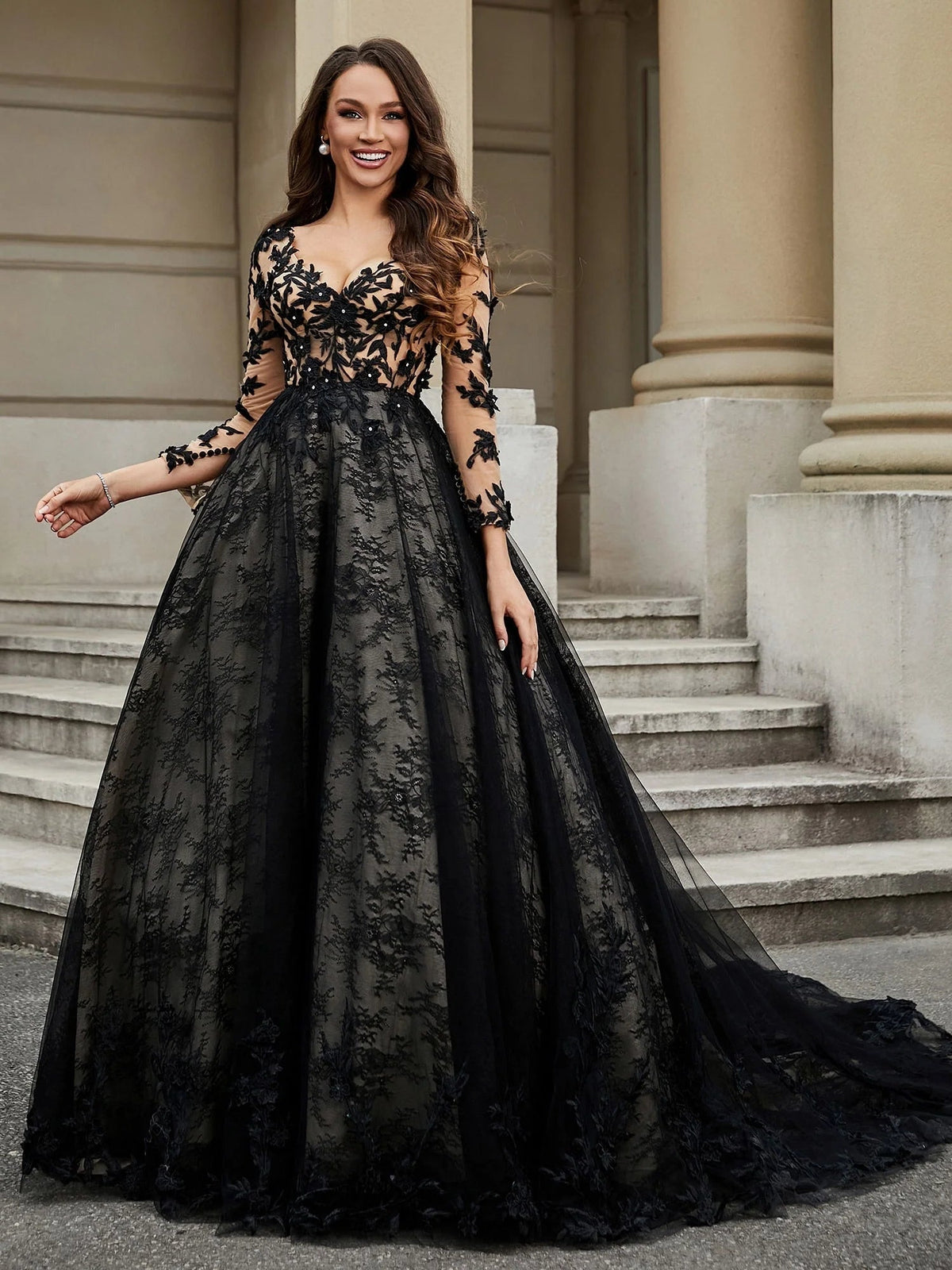 Black V-neck tulle wedding dress with floral lace sleeves and A-line floor-length skirt