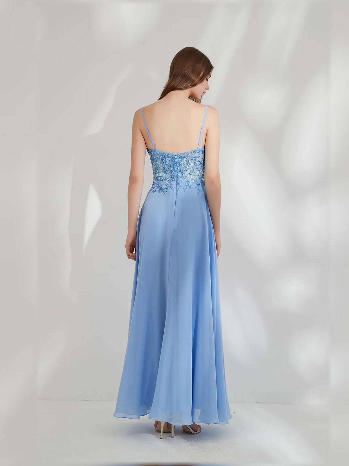 Blue floral A-line formal dress, lace bodice, back view, spaghetti straps, floor-length