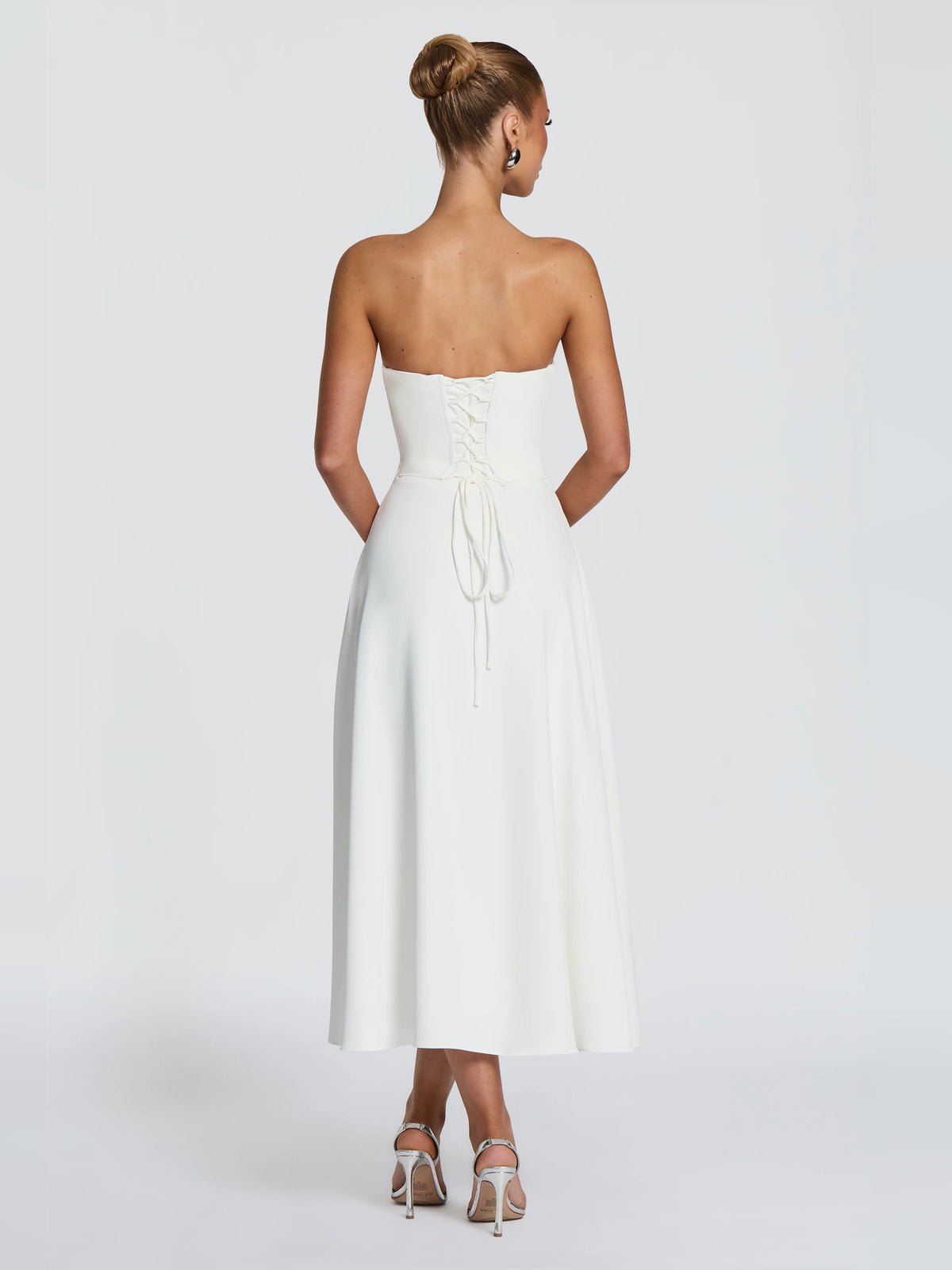 Ivory strapless midi dress, back view with ruched drawstring detail