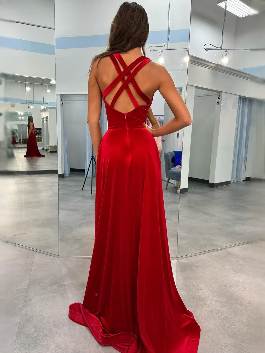 Red velvet open-back maxi prom dress with crisscross straps and front leg slit