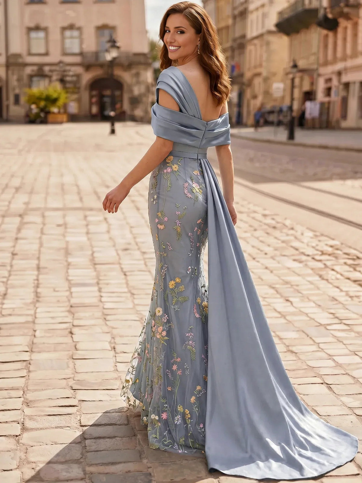 Blue off-shoulder mermaid formal gown with floral print and draped sleeves, floor-length