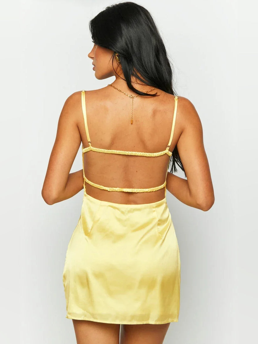 Yellow satin mini dress with open back cutout and thin spaghetti straps