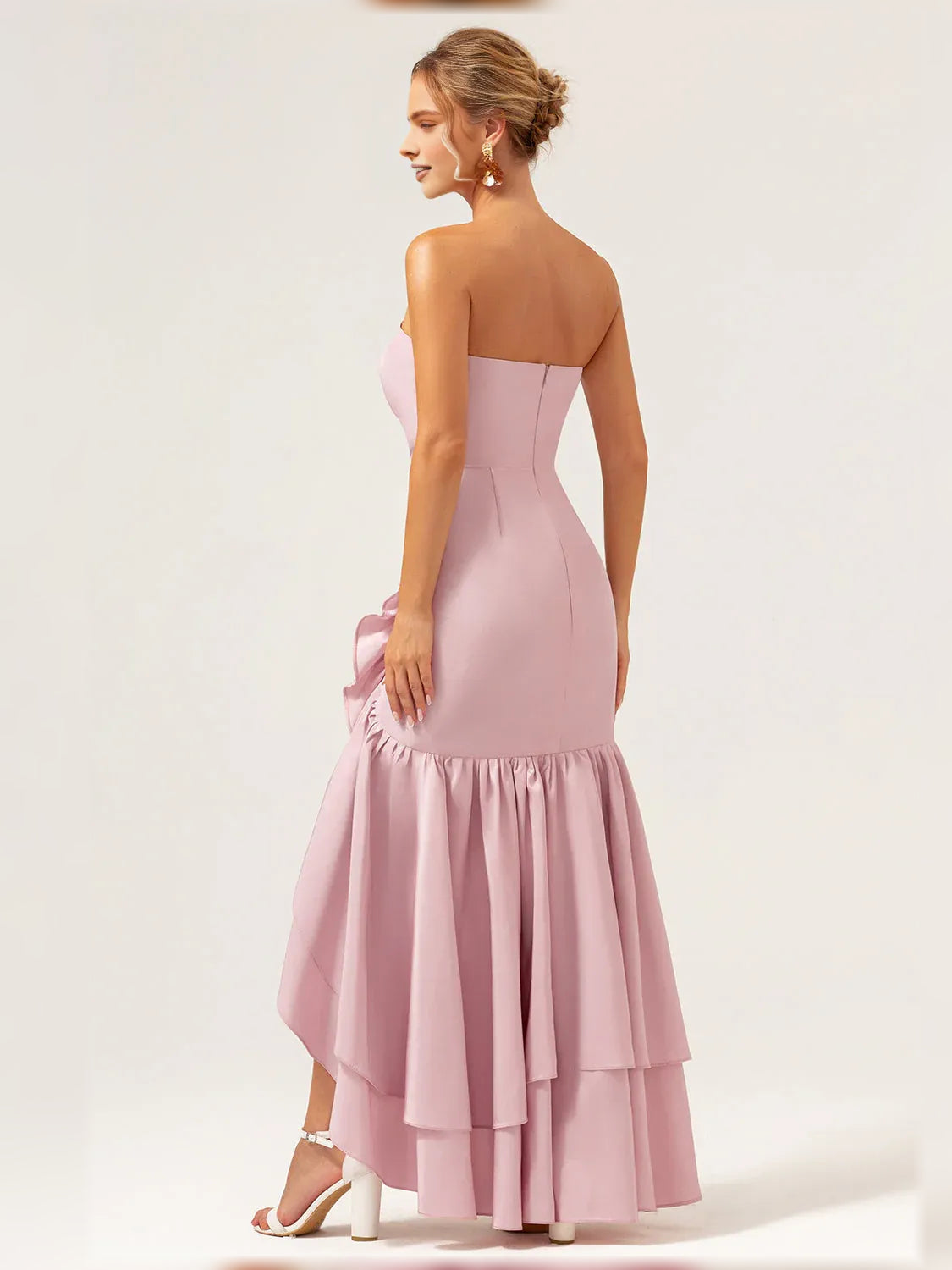 Light pink strapless tiered ruffle formal dress, back view with layered skirt