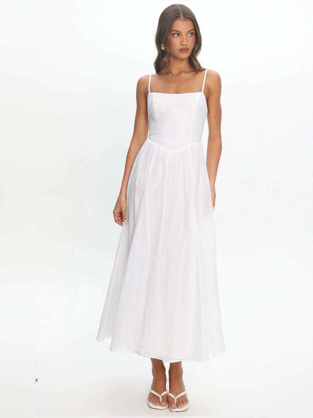 White scoop-neck midi formal dress with spaghetti straps and flowy gathered skirt