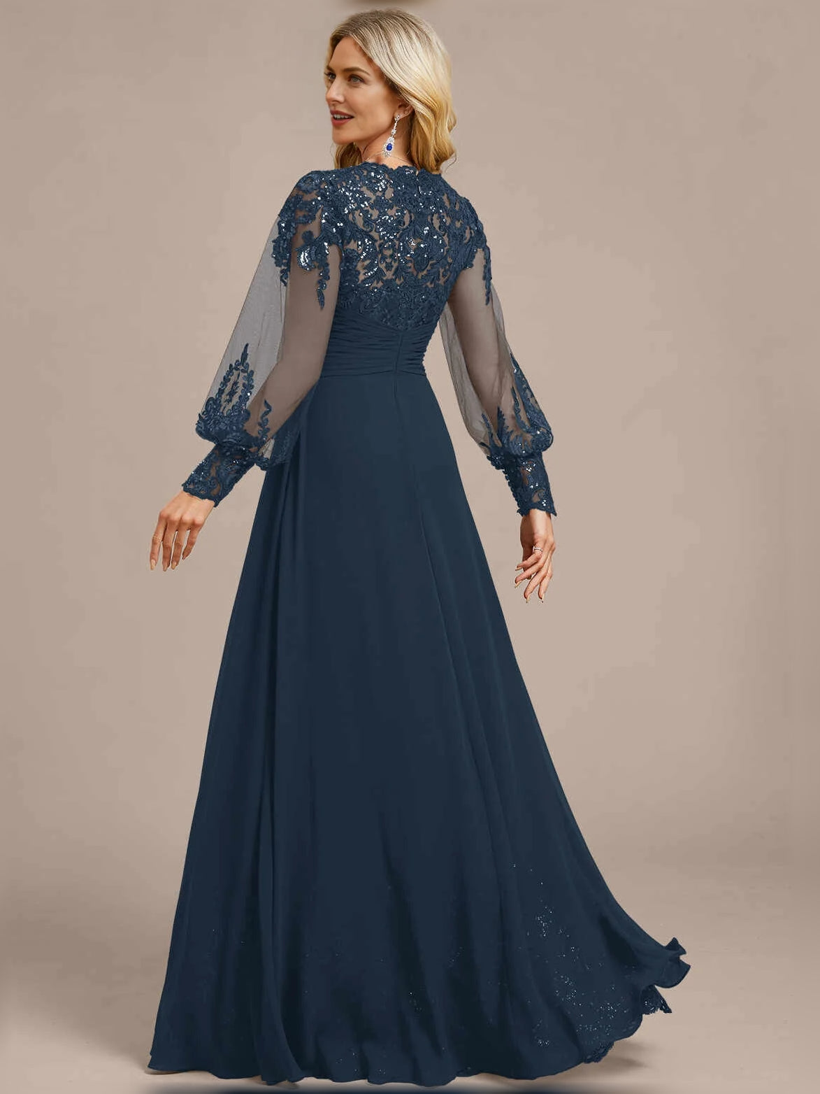 Floor-length navy V-neck A-line dress with ruched bodice and sheer sequined sleeves