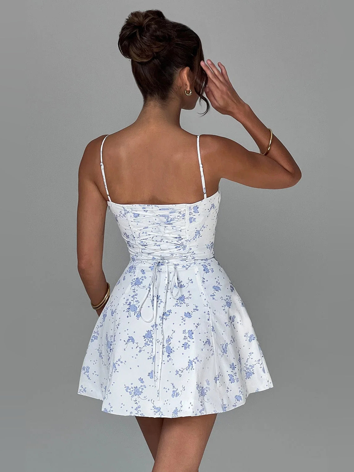 Floral print mini dress with open back and thin spaghetti straps