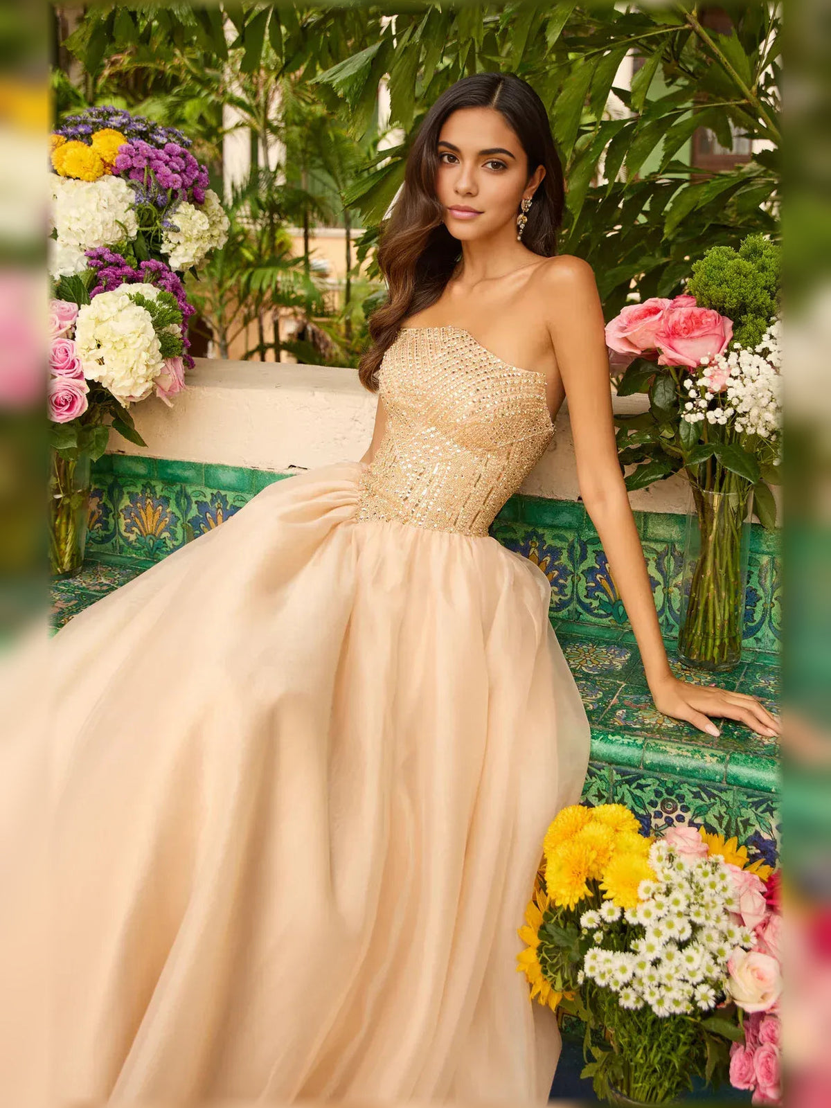 Gold strapless beaded corset bodice with voluminous floor-length tulle skirt