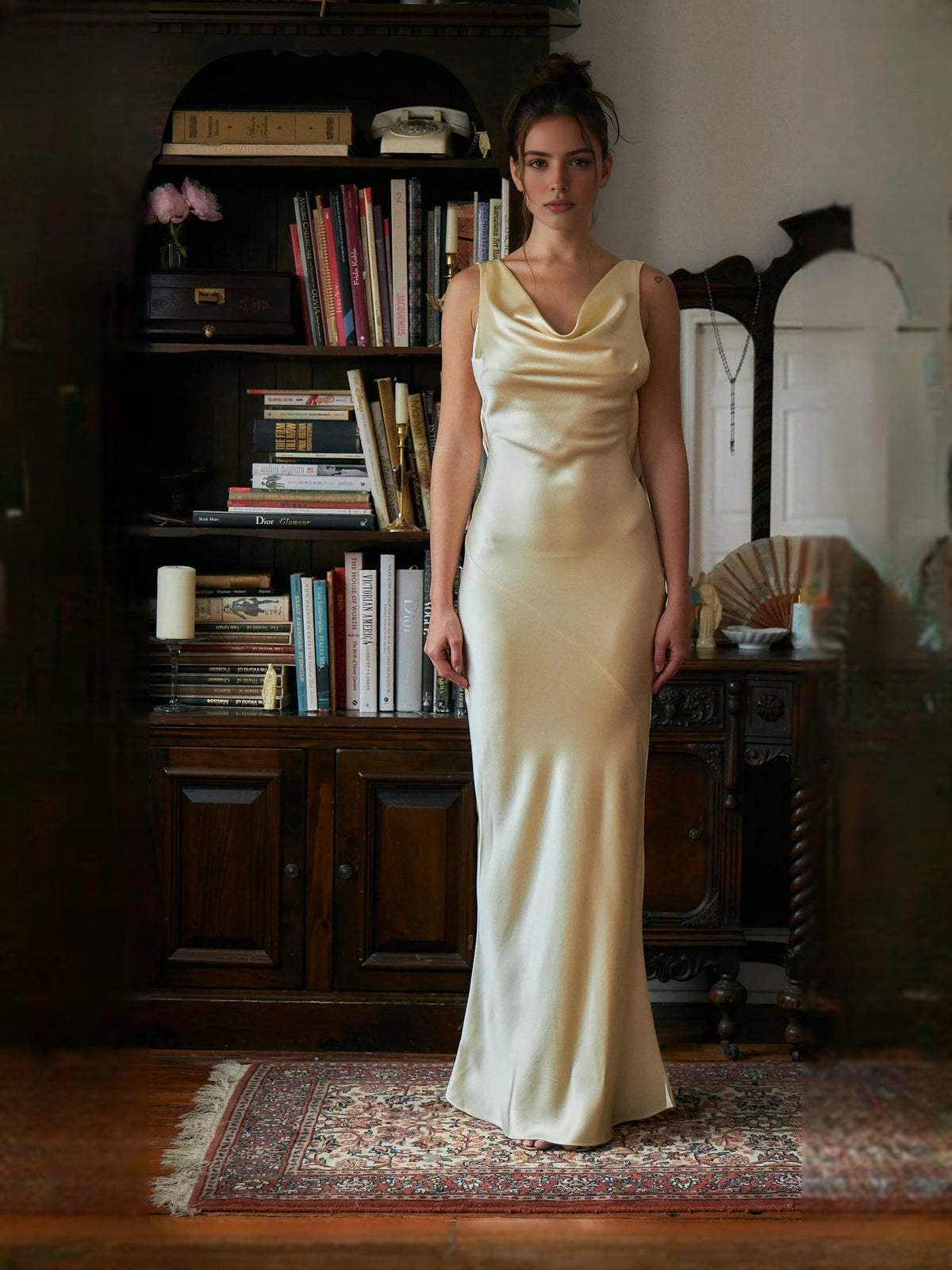 Ivory satin mermaid prom dress with sleeveless cowl neck and fitted floor-length skirt.