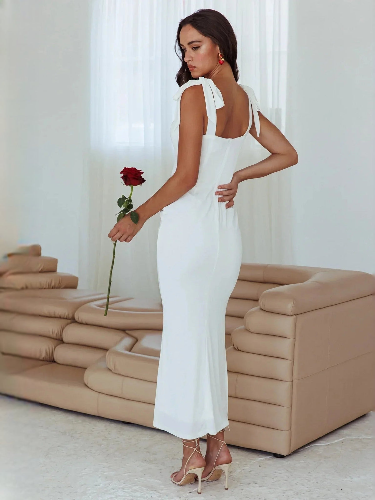 White sheath midi wedding dress with tied bow shoulder straps and square back neckline