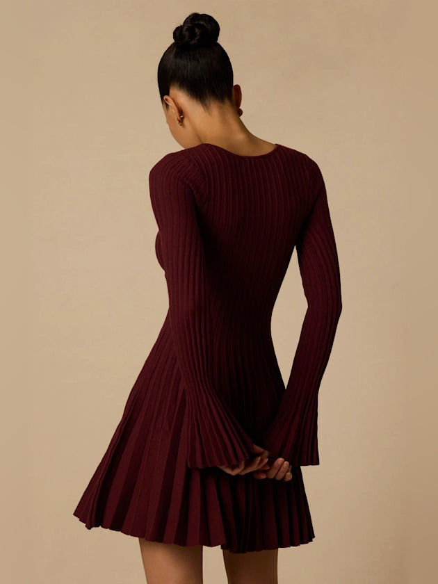 Plum cut-out mini dress, long sleeves, back view with fitted ribbed knit bodice