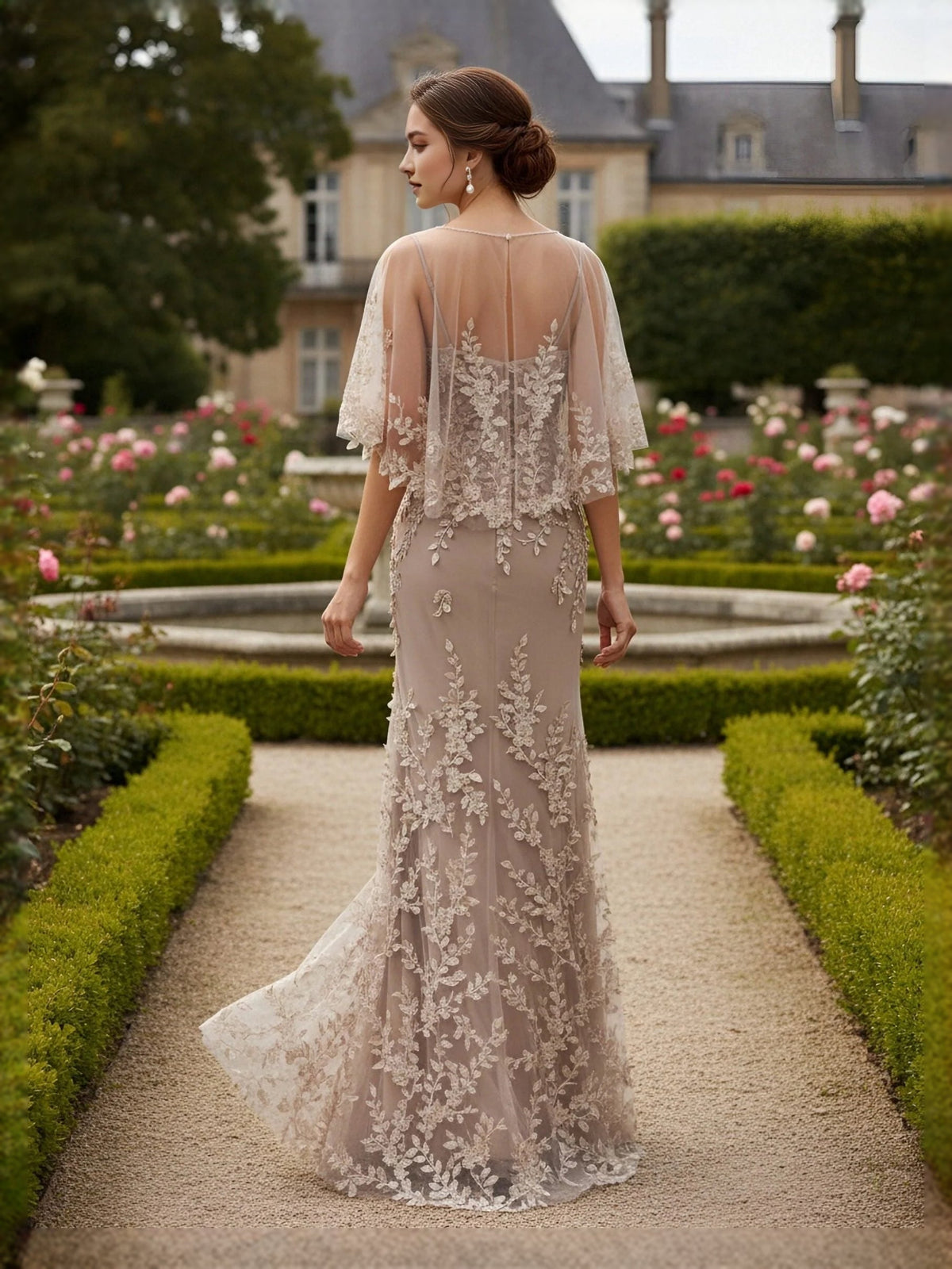 Ivory tulle mermaid maxi dress, back view with floral applique and 3/4 sleeves