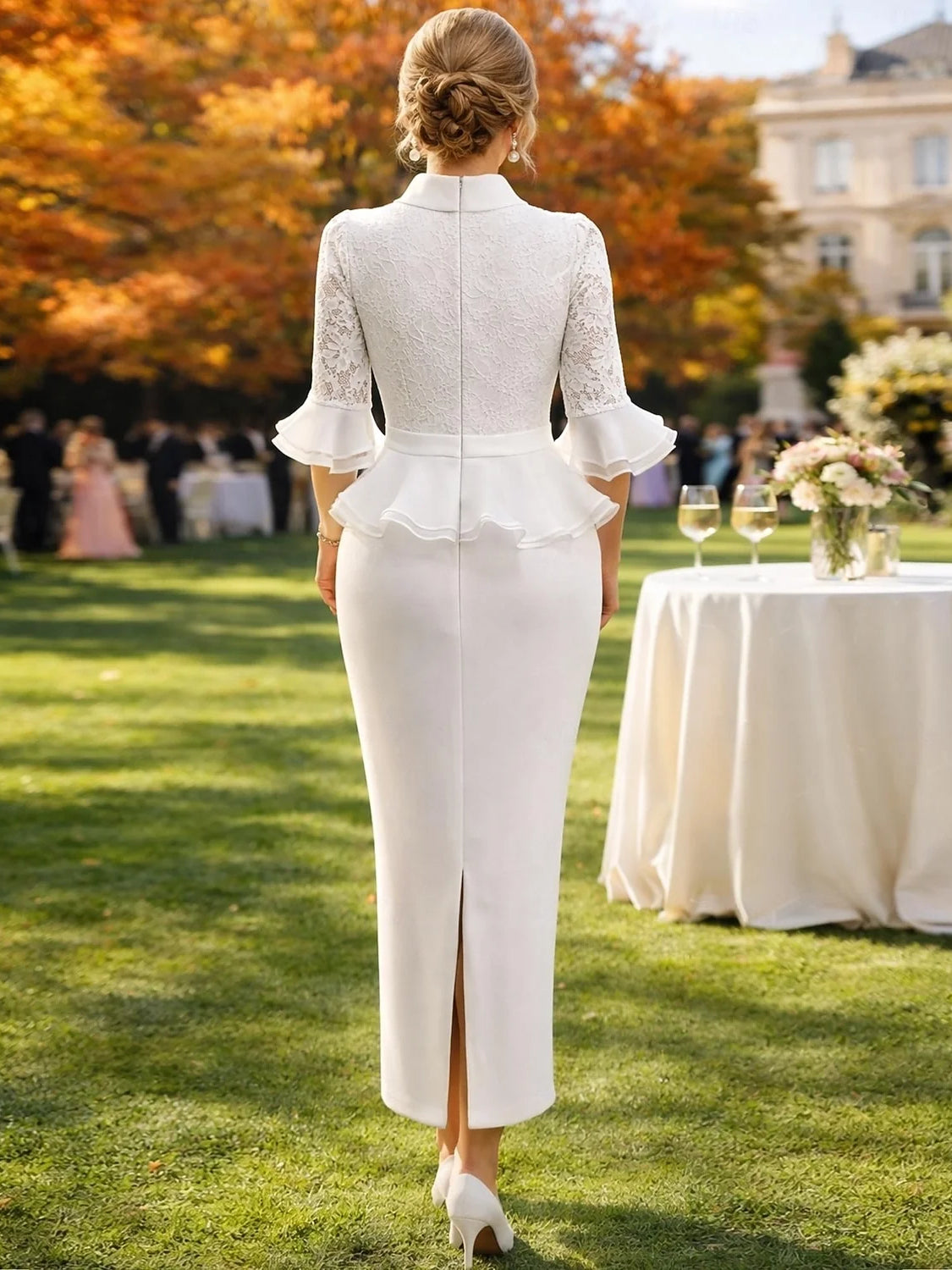 Ivory back-view sheath dress with lace sleeves, ruffled cuffs, and center back slit