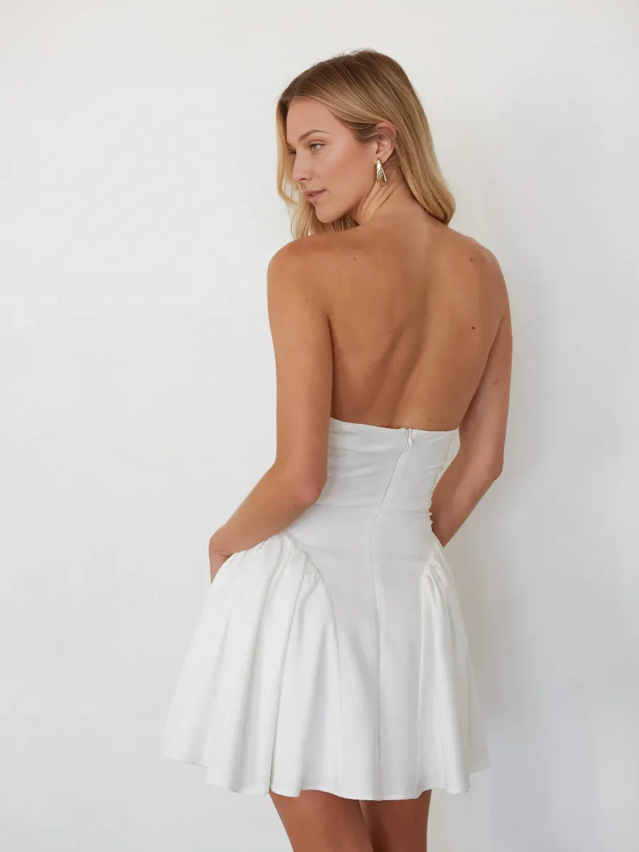 White strapless mini A-line dress, ruched waist detail, open back view