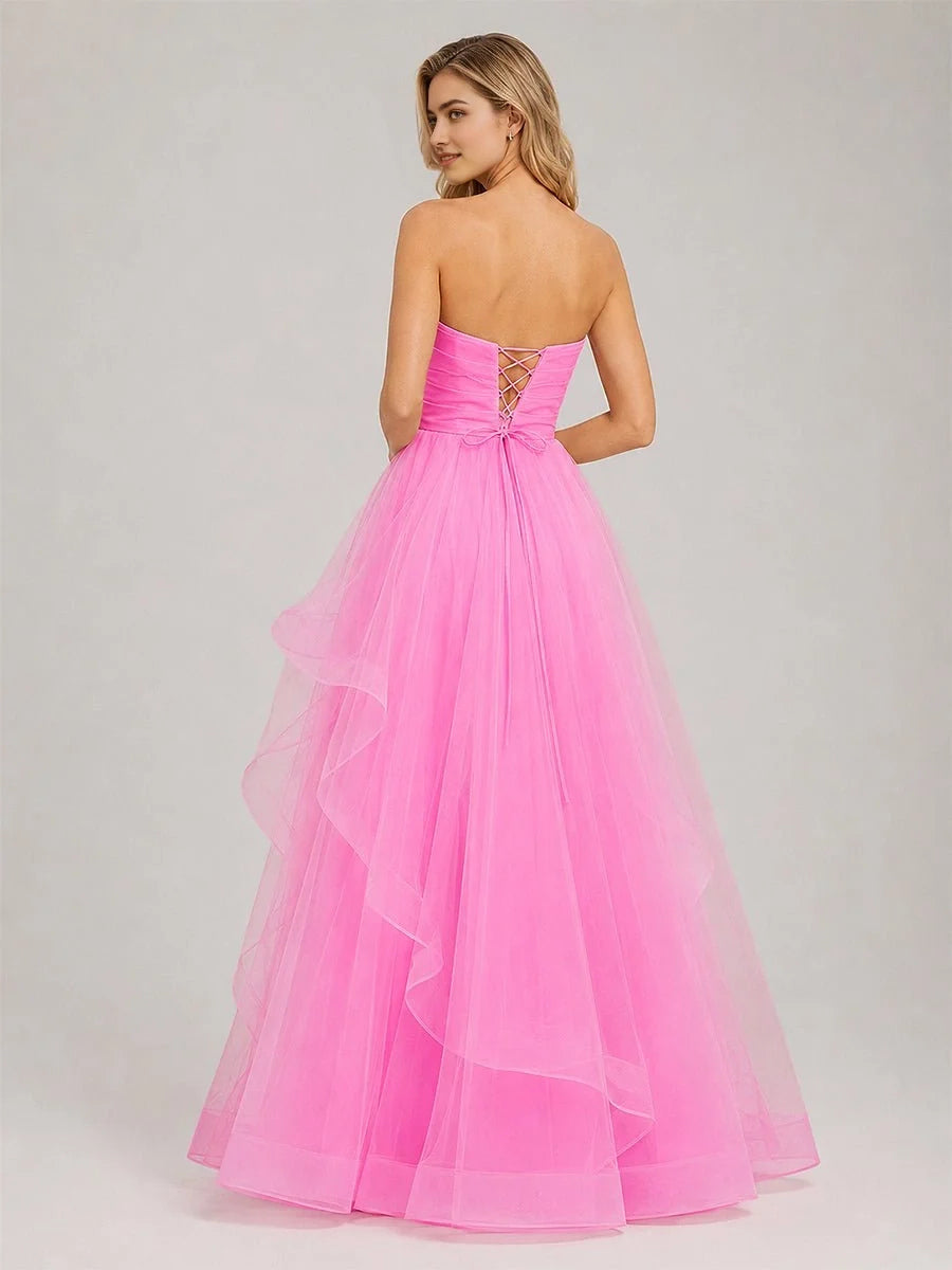 Light pink strapless backless prom dress with crisscross lace-up and layered tulle skirt