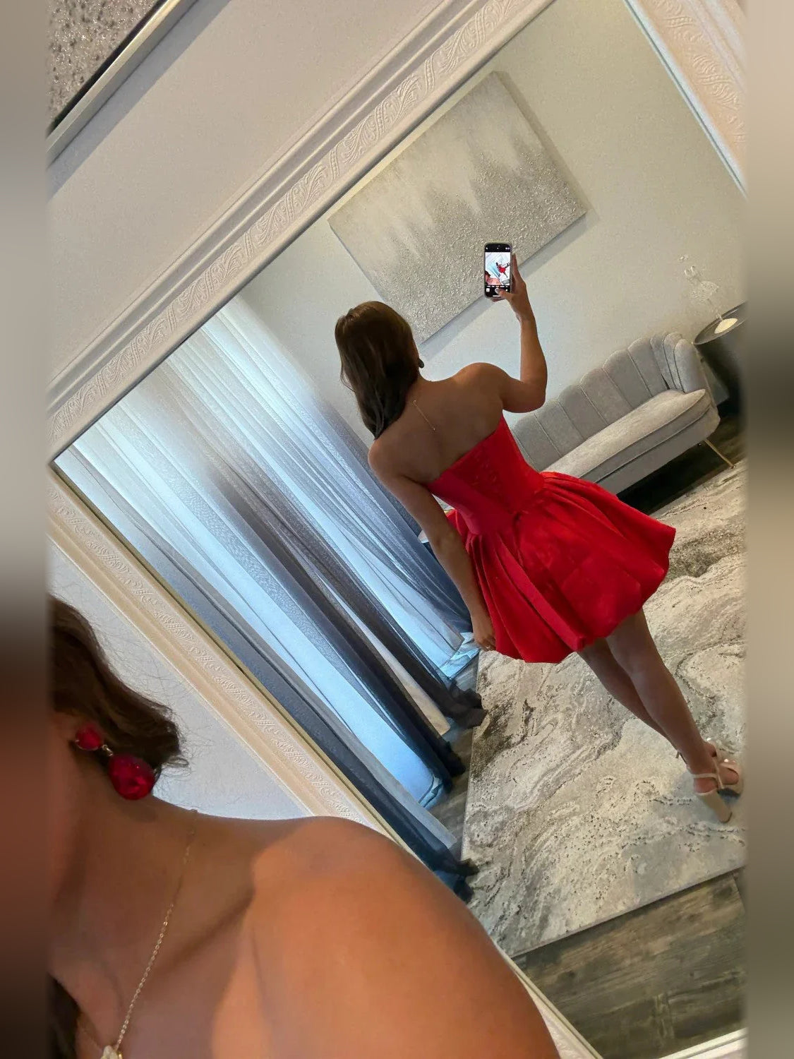 Red strapless mini dress back/side view with gathered rosette ruffle skirt