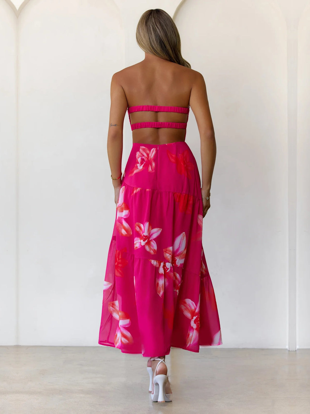 Pink a-line maxi formal dress with floral print, full-length back view