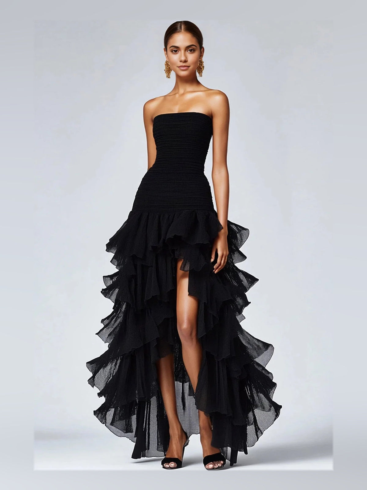 Black strapless prom dress with ruched bodice, tiered ruffles, and high slit