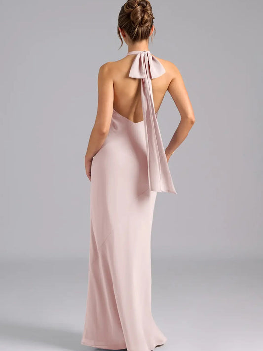High-neck chiffon sheath maxi dress, blush pink, open back with tied ribbon detail.