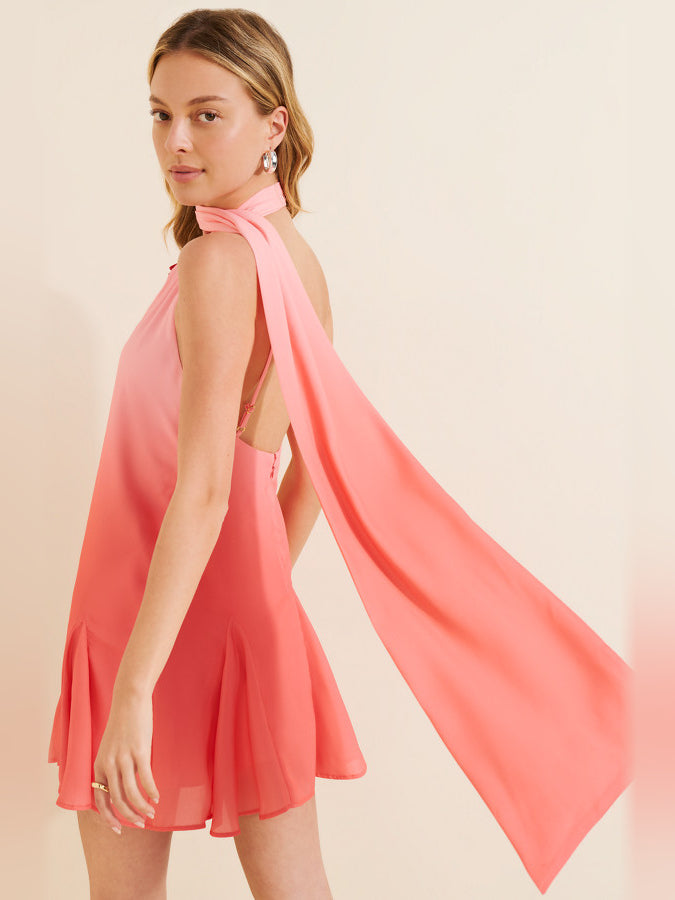 Pink sleeveless halter mini dress with draped neck and flowing skirt panels