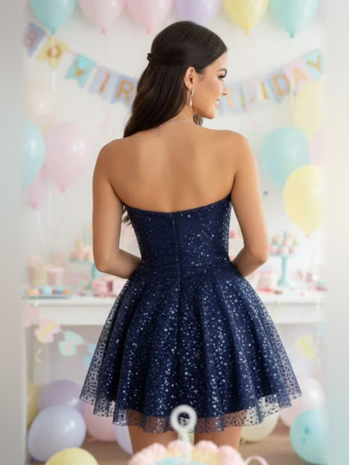 Navy sequin A-line mini dress with open back and layered tulle hem, sleeveless