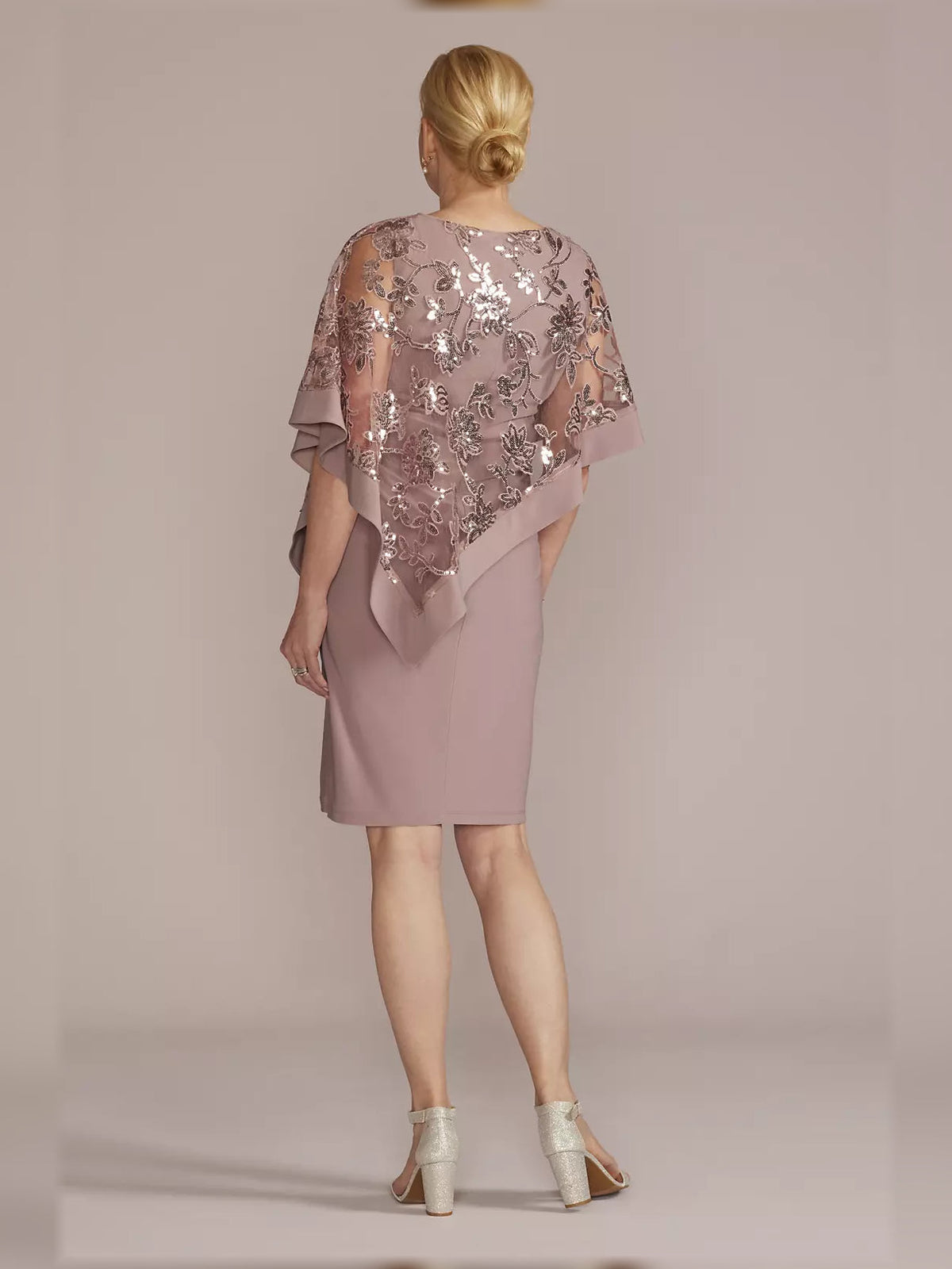 Back view mauve sequin sheath dress with draped cape sleeves, knee length
