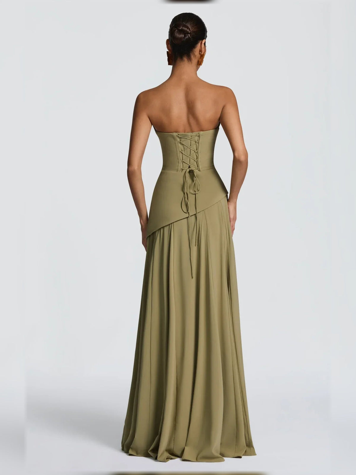 Dusty sage strapless corset dress with lace-up back detailing and floor-length skirt